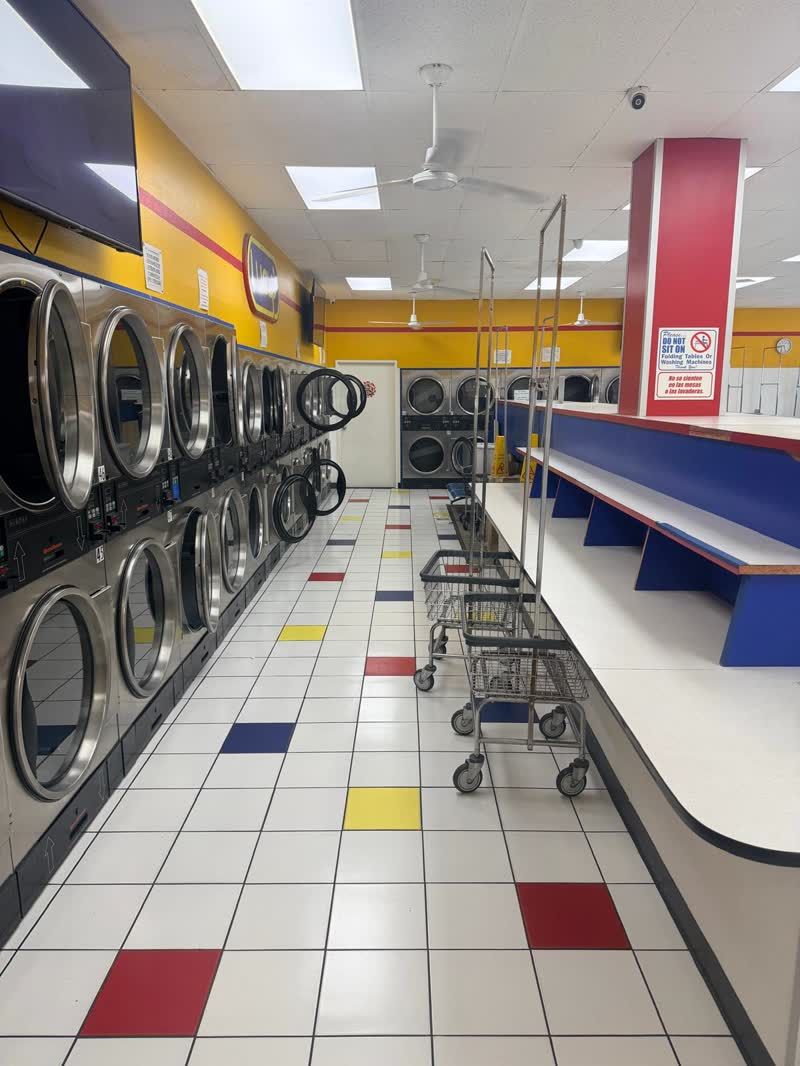 Washers and dryers along the wall